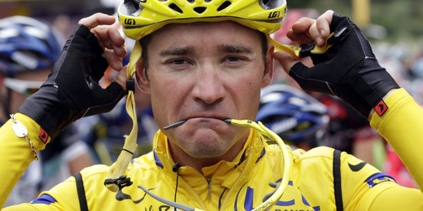 Europcar rider Thomas Voeckler of France, wearing the yellow jersey, adjusts his helmet at the start of the 15th stage of the Tour de France 2011 cycling race from Limoux to Montpellier